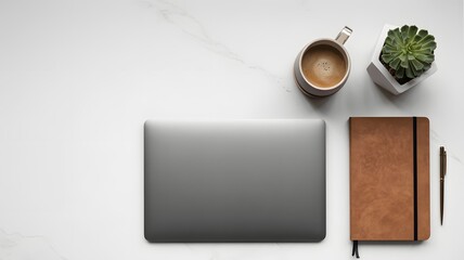 Modern workspace setup with laptop, coffee, and notebook on marble desk