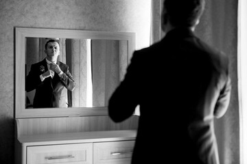 portrait of the groom of a man in the morning before the wedding