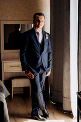 portrait of the groom of a man in the morning before the wedding