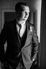 portrait of the groom of a man in the morning before the wedding