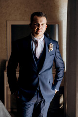 portrait of the groom of a man in the morning before the wedding