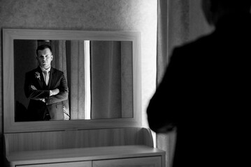 portrait of the groom of a man in the morning before the wedding