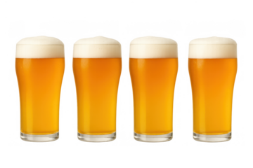 Four glasses of fresh golden beer with frothy white foam on top, refreshing classic alcoholic beverage