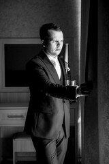 portrait of the groom of a man in the morning before the wedding