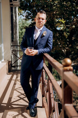 portrait of the groom of a man in the morning before the wedding