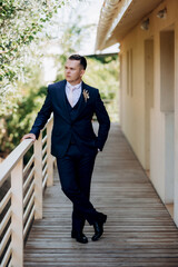 portrait of the groom of a man in the morning before the wedding