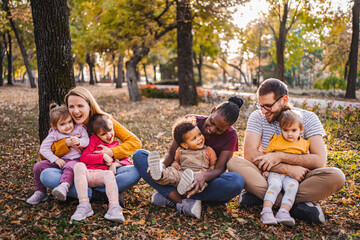 Fototapeta premium Autumn Embrace: A Tapestry of Family Love