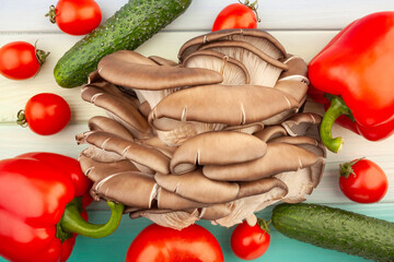 oyster mushrooms vegetable mix on wood background