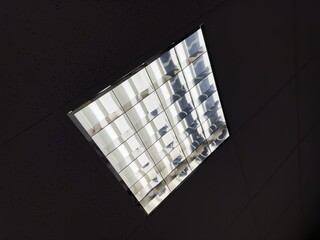 Ceiling light with mercury-vapor bulbs in the interior of office