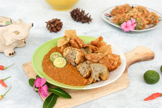 Batagor, a traditional savory dish from Bandung, consists of fried fish dumplings generously served with thick peanut sauce.