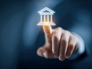Businessman interacting with a glowing bank building icon symbolizing financial technology and digital banking services in a futuristic concept