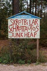 view of the sign at the entrance of the Kirkomosse Car Cemetery near Ryd in southern Sweden