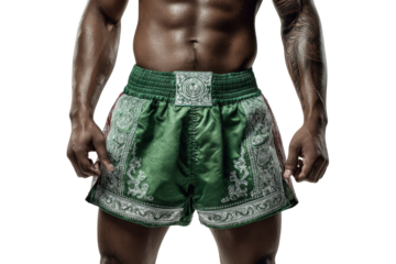 Muscular man wearing green muay thai shorts isolated on transparent background. Muscular athlete wearing muay thai shorts isolated on white background.