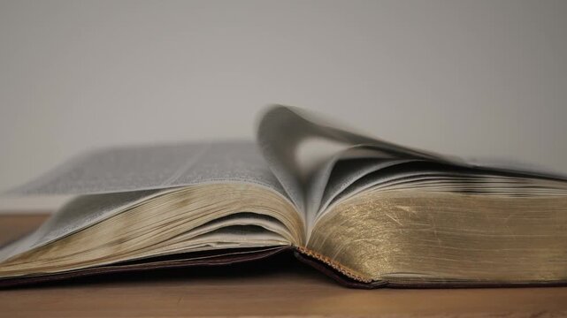 Bible pages flipping by air