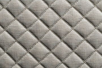Fototapeta premium neutral background of diamond quilted fabric