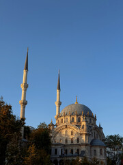 The elegant Nusretiye Mosque in the Baroque style with its two slender minarets at sunset, located in the Tophane district near Istanbul