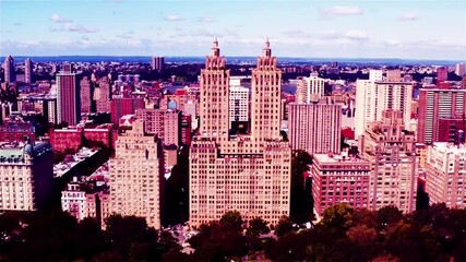 Vibrant cityscape with iconic skyscrapers and lush greenery under blue sky