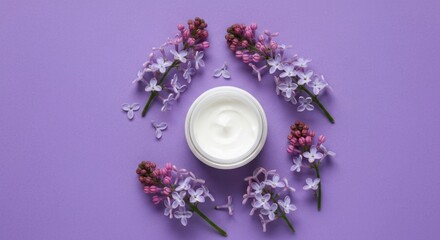 Jar of cream surrounded by purple flowers on a pastel purple backdrop