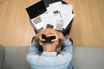 Household financial economic concept, Stressed Young Asian adults are looking at credit card bills...