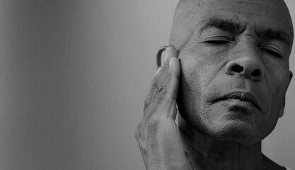 deafness suffering from deafness and hearing loss Senior man cupping his ear having difficulty hearing on gray background with people stock photo stock image