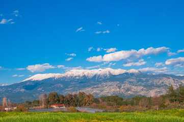 Landscape with mountains and blue sky.