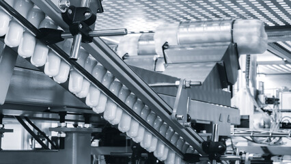 Naklejka premium Machine for producing plastic beverage bottles using extrusion method from plastic.