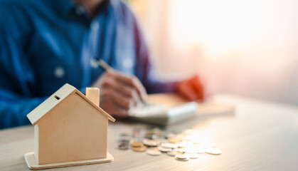 Close-up a house bank for saving bank for account save money. Planning step up, saving money for future plan, retirement fund. Business investment-finance accounting concept.