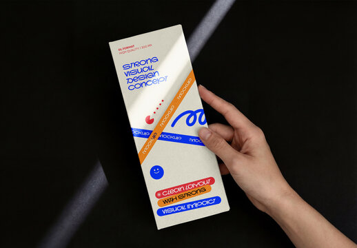Template Mockup Vertical Flyer Branding and Identity Design Held in Hand with Dramatic Light on Dark Background