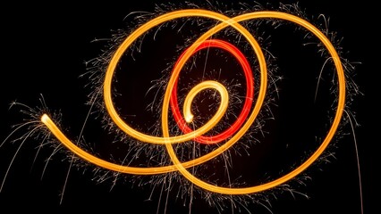 Vibrant orange and red light trails in a dark background