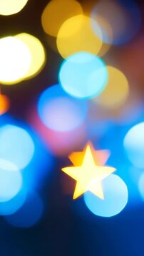 Colorful star-shaped blurred bokeh on black background. Abstract lights loop. New year and Christmas. Shimmering glittering particles with bokeh. 4K, vertical video, social media, 9:16, insta story