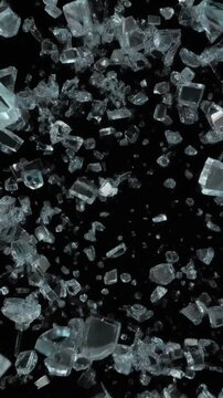 Shattered Glass Fragments Tumbling in Mid-Air Against a Dark Background