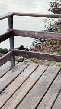 Walking along the calm embankment of the Dnypro in Obolon reveals soft autumn light and a peaceful riverside mood in Kyiv, Ukraine.