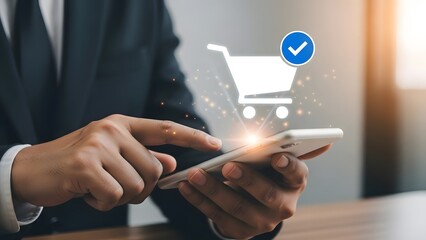 Businessman completing an online shopping order successfully using a mobile phone app with a glowing digital shopping cart icon and confirmation checkmark above