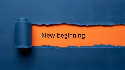 Ripped blue paper reveals bright orange background with the inspiring text new beginning symbolizing fresh starts hope and opportunity for change