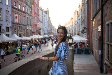 Woman on bridge above Old Town street market in Gdansk Poland