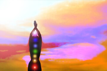 Silhouette of a woman in yoga pose with seven glowing chakras on a sunset background.