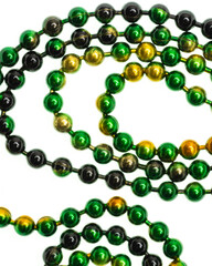 Metallic green and yellow bead chain on white background