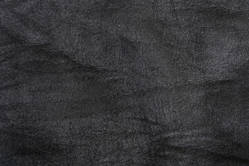 Crumpled black suede textured horizontal background