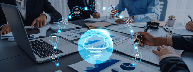 A professional team collaborates on cloud computing solutions, with digital icons representing key aspects like data security and technology innovation in a modern workspace. Trope