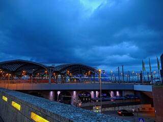 Cologne train station at night, December 19, 2025. City evening landscape. Night blue sky. Europe, Germany, Cologne city..