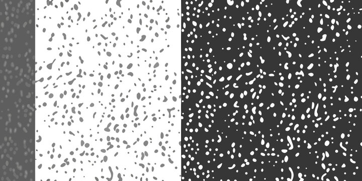 Abstract black and white speckled pattern divided into four quadrants