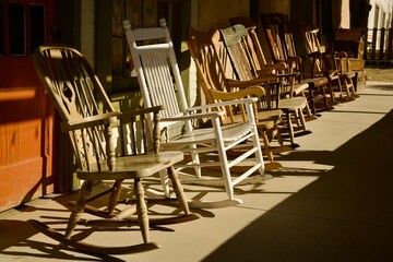 assortment of rocking chairs on the porch