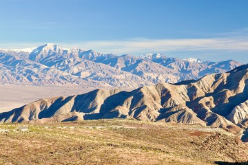 desert mountain landscape with snow