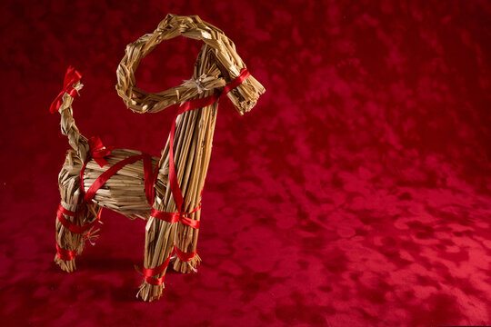 Julbock Straw Goat on Red Background