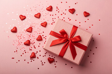 Romantic Gift Box Surrounded by Red Hearts and Confetti