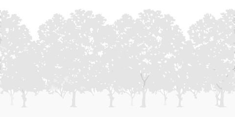 Obraz premium A serene landscape featuring a dense row of silhouetted trees against a white backdrop