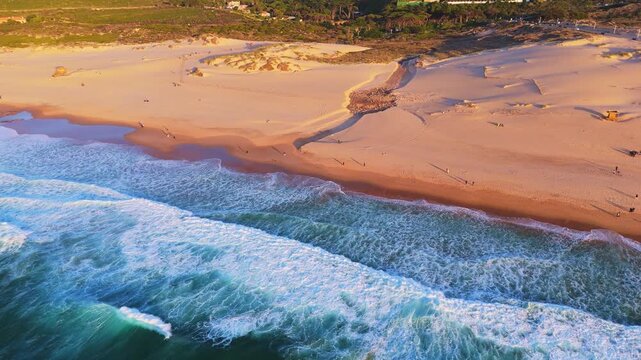 Guincho Beach, Sand Dunes Early Evening. Aerial High-Angle Shot. Atlantic Ocean, Portugal. Moving Sideways