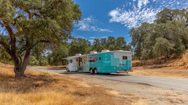Medium shot of a mobile veterinary unit parked on a rural road highlighting accessibility for onsite animal treatment.
