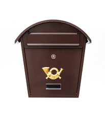 Vintage brown metal mailbox with a golden post horn emblem and curved roof, isolated on a white background.