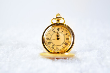 pocket watch in a white background, macro.